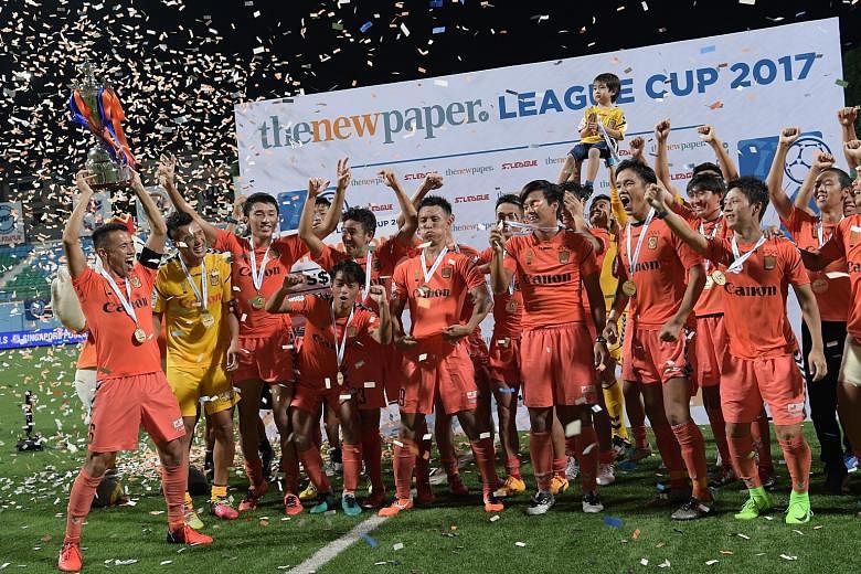 Albirex Niigata players celebrating after their extra-time victory over Warriors FC at the Jalan Besar Stadium last night.