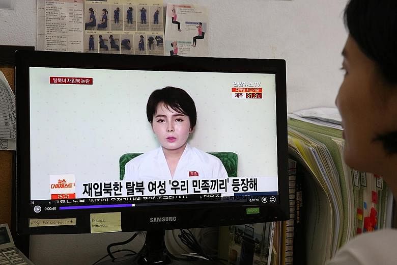 Left: A screengrab of Ms Im Ji Hyun in a show broadcast by South Korea's TV Chosun. Above: A news report on South Korean television last Wednesday showing Ms Im in the video allegedly taken after her return to the North.