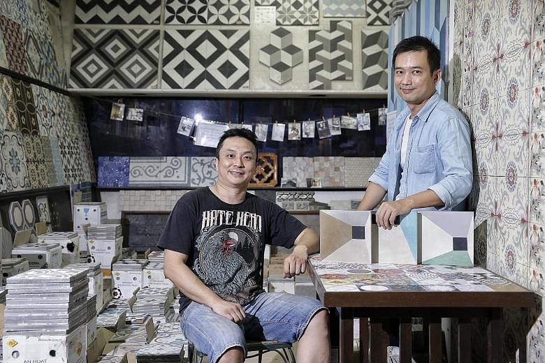 An Huat Trading director Lau Sze Siong (left) with Mr Mike Tay, designer of some of the tiles in the shop.