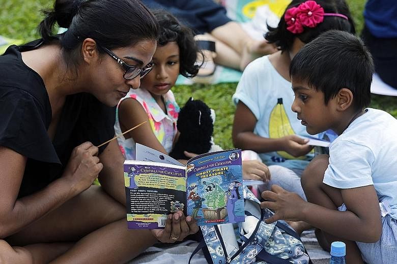 Young concertgoers also got to enjoy a good read as about 2,000 books were given out, sponsored by Scholastic. Attendees at The Straits Times Concert in the Gardens at the Singapore Botanic Gardens yesterday enjoyed an hour-long performance by the Si