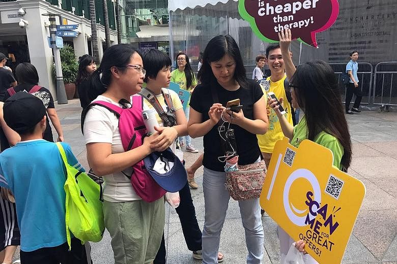 As part of the Great Singapore Sale, rovers from the GoSpree app reached out to shoppers at various locations, such as Bugis Junction, Orchard Road and Marina Bay. The event, which is back for the second time this year, was held from 2pm to 7pm yeste