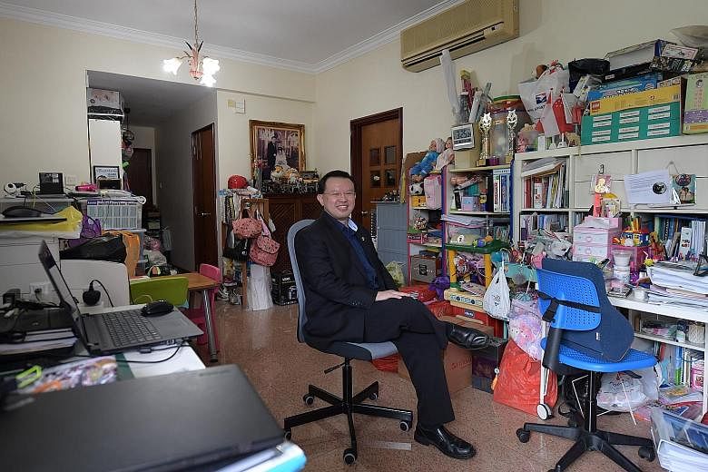 Property investor Goh Kuan Keat in his Bukit Timah condo (right, bottom). Mr Goh, who has two children, says he likes investing in condominium units as it "makes better financial sense... compared with landed property". Mr Goh's penthouse (top) in Ku