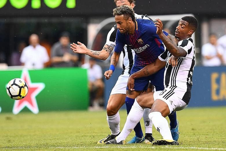 Barcelona forward Neymar vying with Juventus midfielder Mario Lemina during their ICC friendly match. The Brazilian international has been strongly tipped for a blockbuster move to French Ligue 1 side PSG.