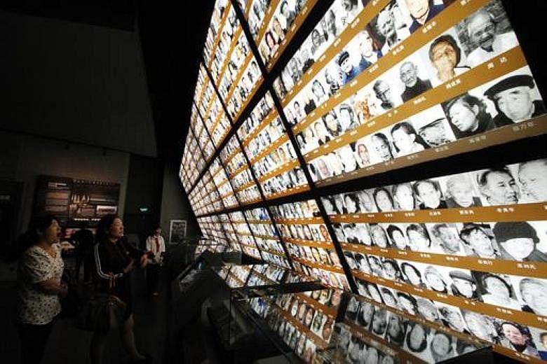 Photos of survivors at the Nanjing Massacre Memorial Hall in Nanjing. The Japanese army is said to have killed some 300,000 Chinese civilians and unarmed soldiers in the massacre.