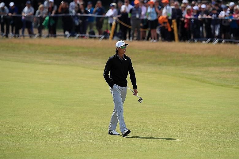 China's Li Haotong walking down the 18th fairway during the final round at Royal Birkdale. He recorded his seventh birdie of the day at the final, par-four hole.