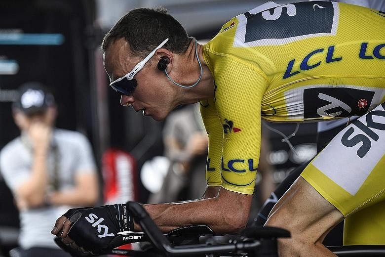 Briton Chris Froome wearing the overall leader's yellow jersey while training ahead of the 22.5km individual time trial around Marseille. He won the 20th stage of the Tour de France to all but wrap up his fourth title.