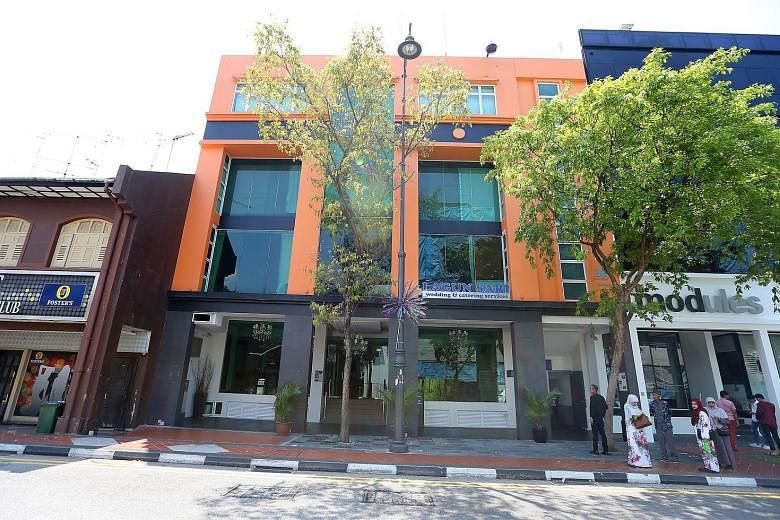 OCN is listed as having a Joo Chiat address, where a Malay wedding planning firm occupies most of the four-storey commercial building.