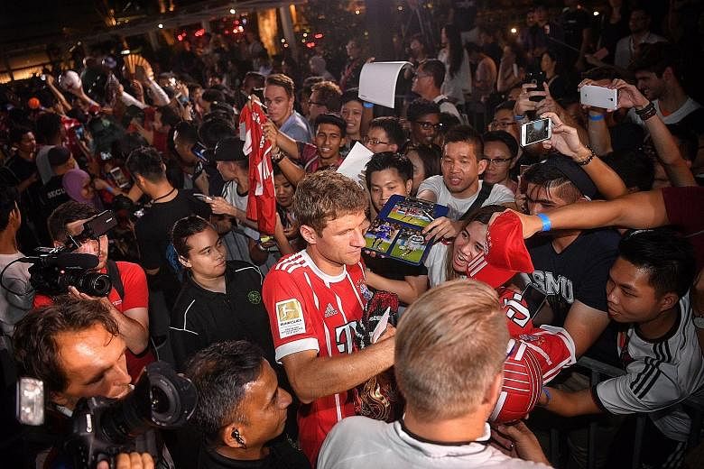 Bayern Munich star Thomas Muller signing autographs for fans at Clifford Square yesterday. The German international had an underwhelming season by his own high standards last term and will want to bounce back ahead of the World Cup.