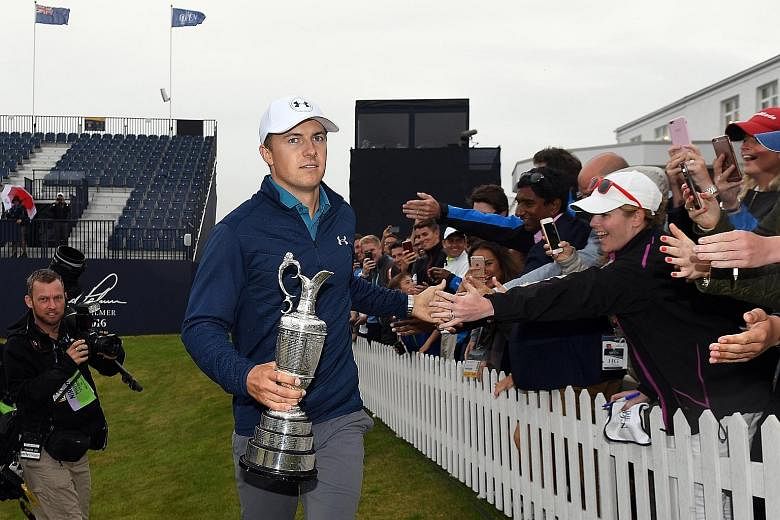 Jordan Spieth holding the Claret Jug and mingling with fans after winning the British Open at Royal Birkdale on Sunday.