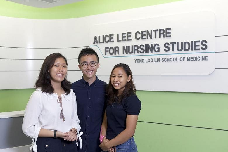From far left: Ms Lim Xin Min, Mr Tan Jung Howe and Ms Nur Diyana Sapri are among the growing number of young people who are showing an interest in the nursing profession. NUS has seen increased demand for its Bachelor of Science, Nursing degrees.