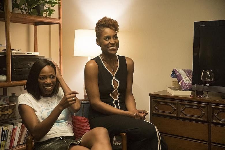 Issa Rae with co-star Yvonne Orji (far left) in Insecure.