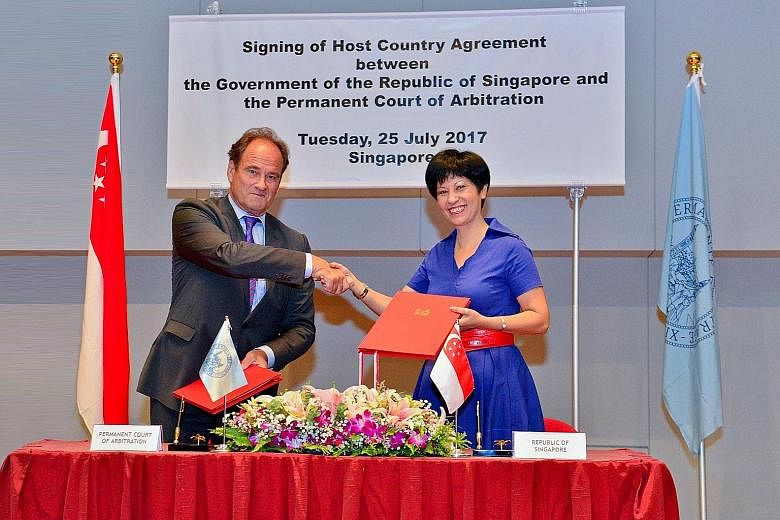 Senior Minister of State for Law Indranee Rajah and Permanent Court of Arbitration (PCA) Secretary-General Hugo Siblesz signed an agreement yesterday to set up the new office here. It will allow the PCA to administer the growing number of its cases b