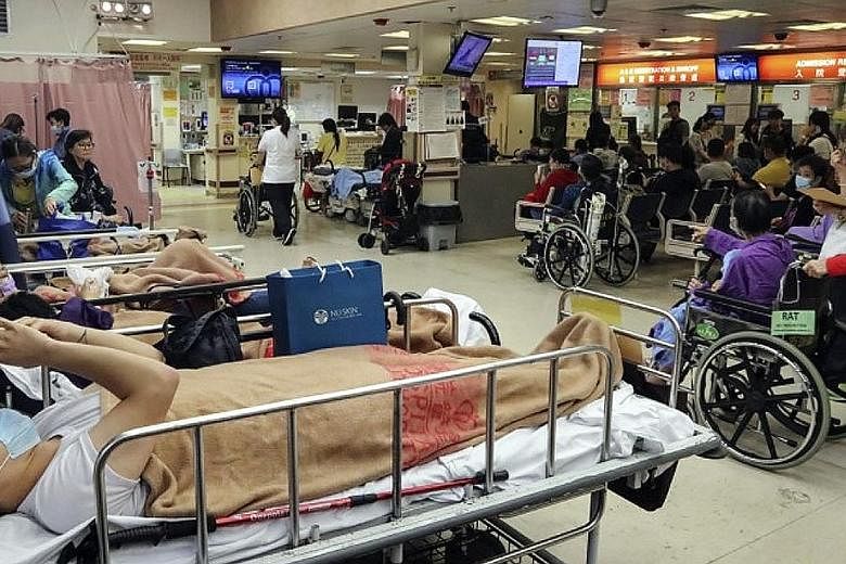 A packed accident and emergency room at Queen Elizabeth Hospital in Yau Ma Tei. Hong Kong hospitals have been stretched to the limit by the flu outbreak, which has led to a manpower and bed crunch.