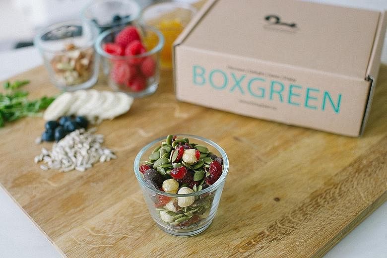Healthy snacks from BoxGreen, one of the social enterprises at the Singapore Coffee Festival. Festival-goers can complete fun and easy socially conscious tasks at the event to redeem rewards such as an eco-friendly reusable coffee tumbler.