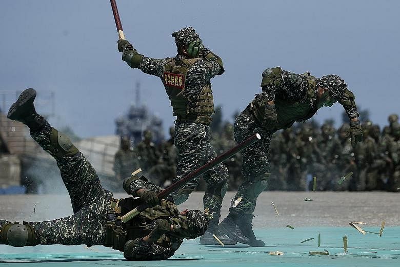 Taiwan navy personnel taking part in a mock attack during a naval exhibition drill in Kaohsiung city earlier this month. In response to recent incidents of Chinese warplanes flying near the island, Taiwan's Ministry of National Defence said that whil