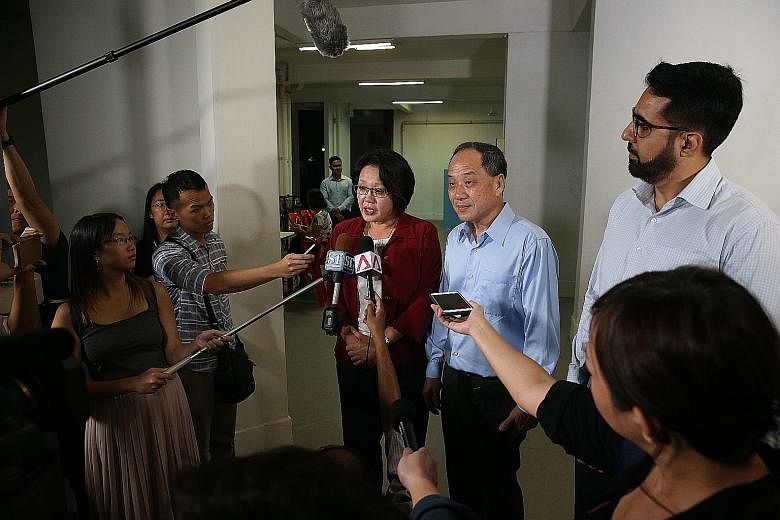 Workers' Party MPs Sylvia Lim, Low Thia Khiang and Pritam Singh speaking to the media before Mr Low's Meet-the-People Session in Bedok Reservoir Road yesterday. In a statement earlier in the day, the WP MPs said they "will contest the lawsuit and lay