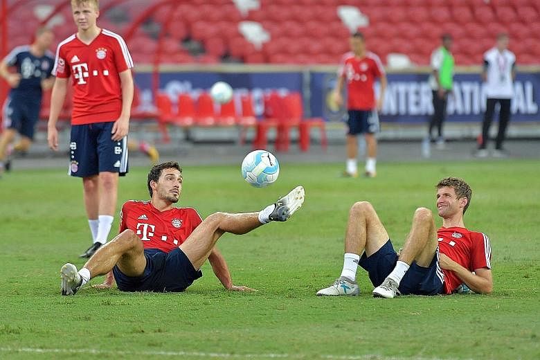 Bayern Munich stars Mats Hummels (left) and Thomas Muller training at the National Stadium ahead of today's clash against Inter Milan. Defender Hummels rates the Serie A outfit as a strong side.