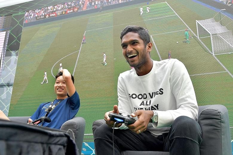 National football captain Hariss Harun enjoying himself in his 6-0 win over Damien Lim in a Fifa 17 game at Kallang Wave Mall. Currently on loan at Home United, he is still hopeful of working something out with his Malaysia Super League club Johor Da