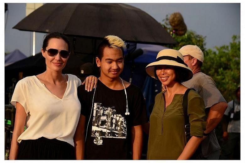 Actress Angelina Jolie with her son Maddox and writer Loung Ung, whose memoir First They Killed My Father has been turned into a film, directed by Jolie.