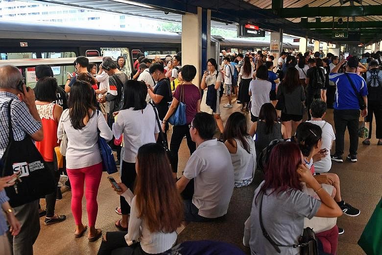 Commuters waiting at the platform after train service at Khatib station was affected by a signalling problem on June 28. Mr Khaw Boon Wan asked for the public's understanding during the new signalling system's testing phase, which he said would take 
