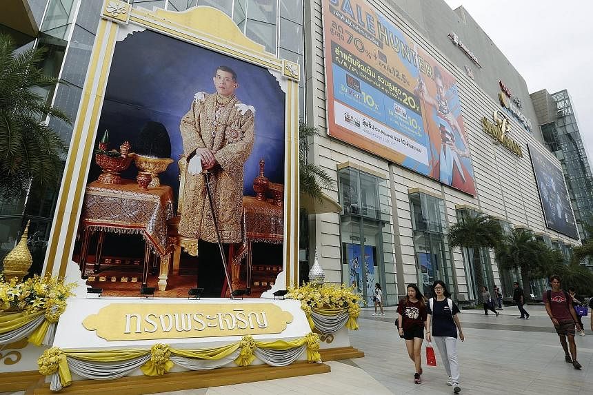 A huge picture of King Maha Vajiralongkorn in front of a shopping centre in Bangkok, ahead of his birthday today. The new king has been putting his own stamp on Thai public life, visiting the restive southern border province of Pattani last November,