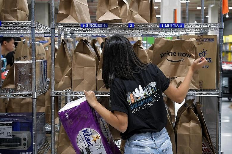 An Amazon employee packing orders. Some consumers could not place orders yesterday due to overwhelming demand.