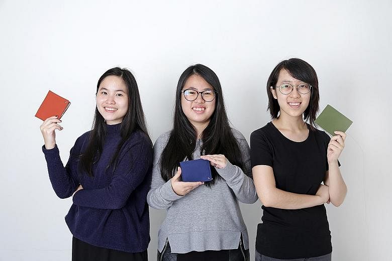 Last year, National University of Singapore industrial design students (from far left) Lim Li Xue, Ng Ai Ling and Cheryl Ho created a wallet called Kin, which separates coins and notes. Launched on crowdfunding platform Kickstarter, the design was a 