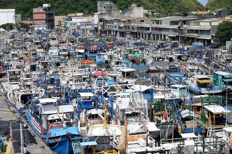 Fishing boats taking shelter at the Nanfangao fishing harbour in Suao, Yilan county in east Taiwan, as Typhoon Nesat approaches. The storm is likely to make landfall in Hualien or Taitung in eastern Taiwan later today, bringing with it strong winds a