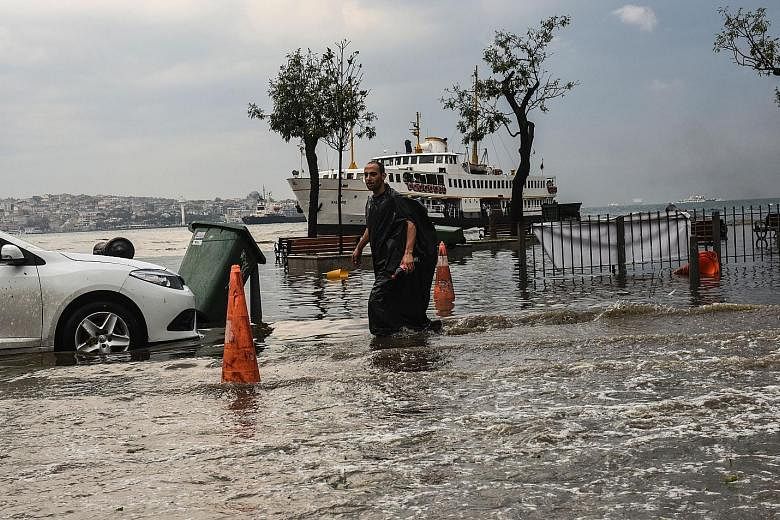 The sudden storm in Istanbul, which lasted only 20 minutes, paralysed traffic and caused flash floods that submerged cars in some streets.