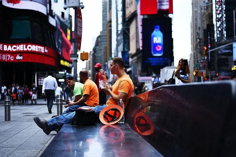 Times Square in New York. With wage growth remaining sluggish despite the labour market being near full employment, there are concerns that consumer spending in the United States could slow in the third quarter.
