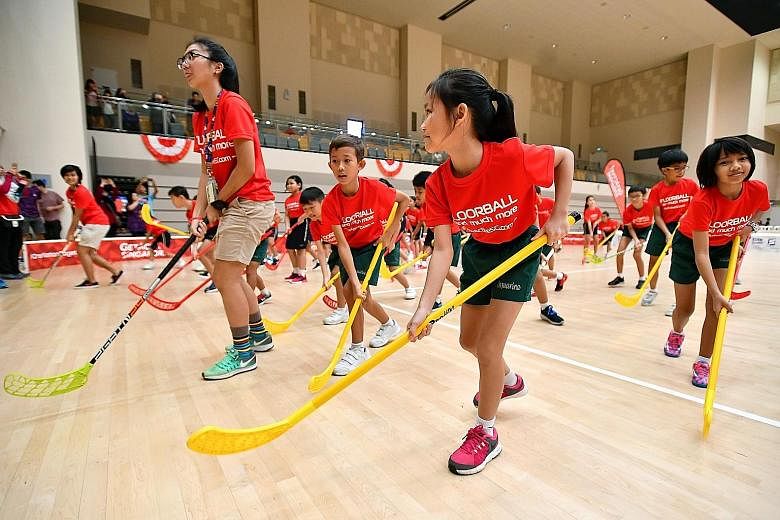 […]Students participate in a workout routine with floorball sticks at the launch of the ActiveSG Floorball Club at Our Tampines Hub. With floorball becoming more popular in Singapore over the last few years, the club intends to help the Singapore F