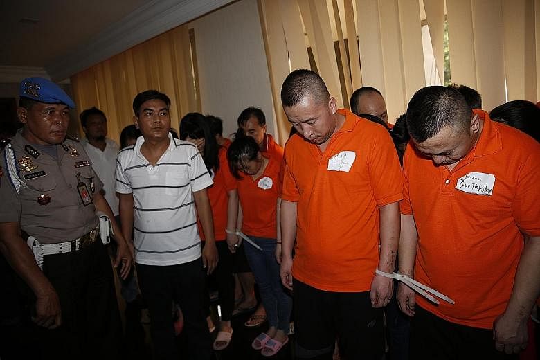 Some of the suspects in the online scam that netted around US$450 million (S$611 million) by tricking people into paying to make legal cases go away.