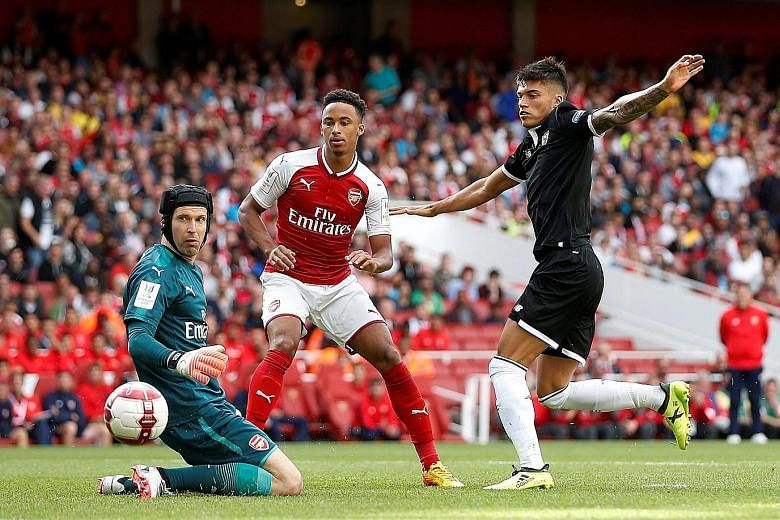 Sevilla's Joaquin Correa scoring the 49th-minute opener against Arsenal in the pre-season Emirates Cup tournament. The Gunners will play Chelsea on Aug 6 in the Community Shield.