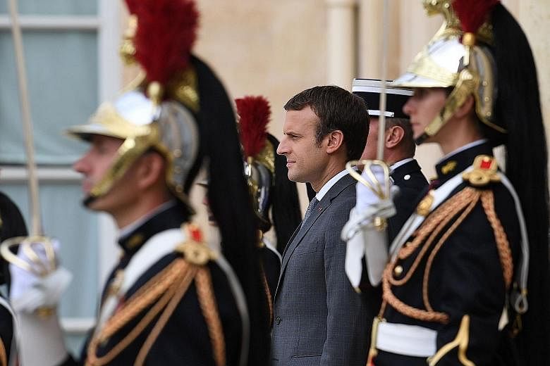 French President Emmanuel Macron seems to have a curious love for the trappings of the office like addressing sailors on France's aircraft carrier dressed in a pilot's bomber jacket, marching up and down rows of honour guards and summoning lawmakers 