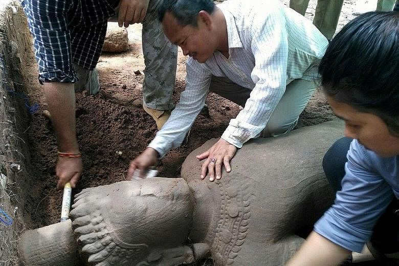 The statue, which is thought to date from the late 12th to the early 13th century, was found during a dig last Saturday by Cambodian archaeologists and experts from Singapore's Institute of Southeast Asian Studies.