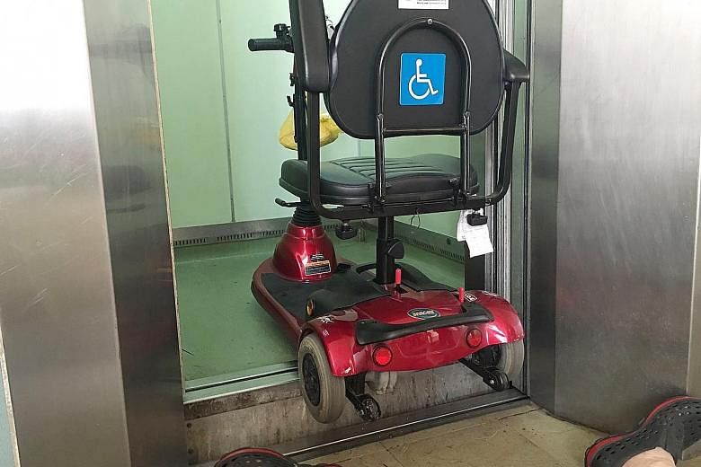 Mr Lim fell backwards after reversing his mobility scooter out of the lift without noticing the uneven levels. Officers inspecting the lift at Block 247, Pasir Ris Street 21, where 77-year-old Lim Hang Chiang fell on May 15 last year. Residents had p
