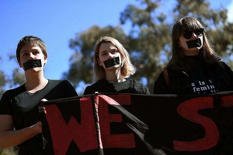 Australian National University students in Canberra protesting against sexual harassment yesterday, after a report on the problem was released.