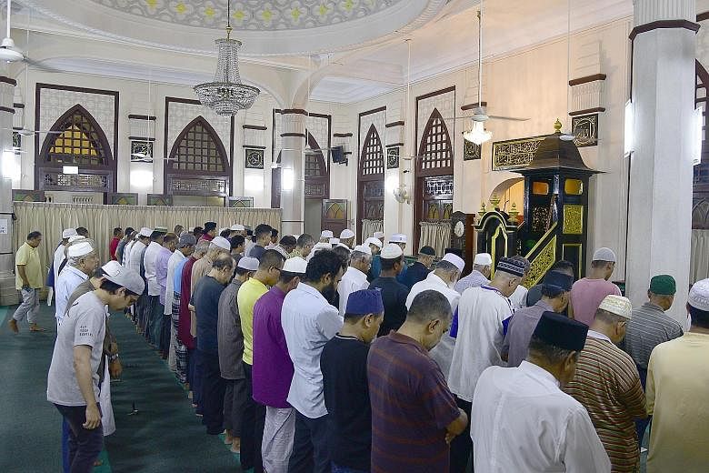 Muslims gather at the Hajjah Fatimah Mosque for a monthly event called the Hasma al Husna. The Alsagoffs were the keepers of the mosque until 1968, when Muis started to manage mosques here. But the family remains active when it comes to matters conce