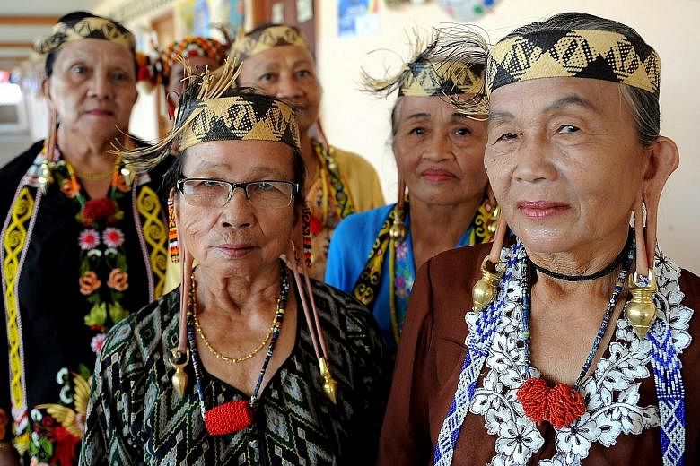 Malaysia's bumiputera include (above) the Orang Asli from the Jahai tribe, the Malays (far left) and the Kayans from Sarawak (left).