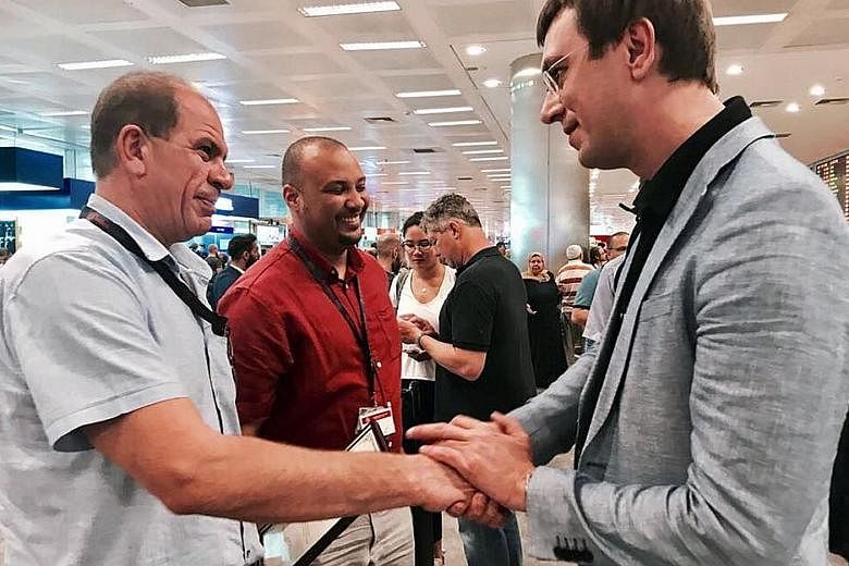 Ukrainian Infrastructure Minister Volodymyr Omelyan (right) greeting Captain Alexander Akopov, who safely landed the plane (below) in low visibility at Istanbul Ataturk Airport last Friday. All aboard were unhurt, and the Ukrainian pilot has been awa