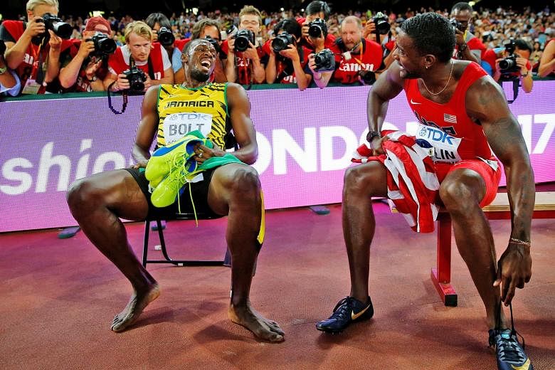 Usain Bolt of Jamaica chatting with American Justin Gatlin after the 200m final at the 2015 World Championships in Beijing. Bolt won the race, with Gatlin finishing second. The duo are expected to battle for the 100m world crown on Saturday.