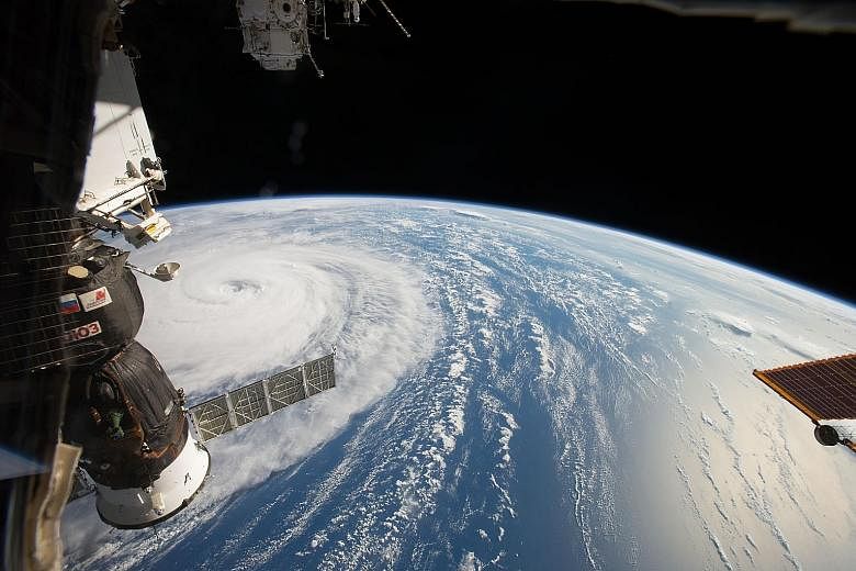 A handout photo from the National Aeronautics and Space Administration (Nasa) showing Super Typhoon Noru in the northern Pacific Ocean, as seen from the International Space Station on Tuesday. According to media reports, the typhoon has maximum winds