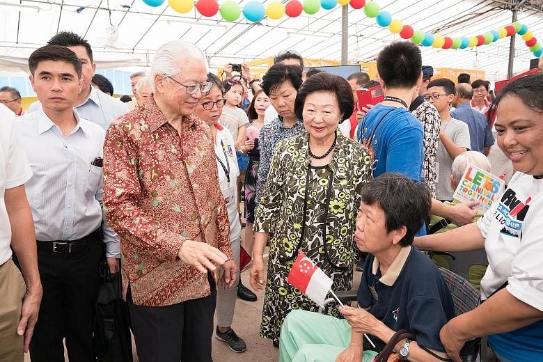 President Tony Tan Keng Yam and his wife Mary joined 700 beneficiaries at the carnival organised by Adam Road Presbyterian Church yesterday.
