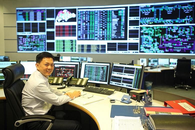 Energy Market Authority control manager Derrick Lim in a room that oversees the transmission of high-voltage power.