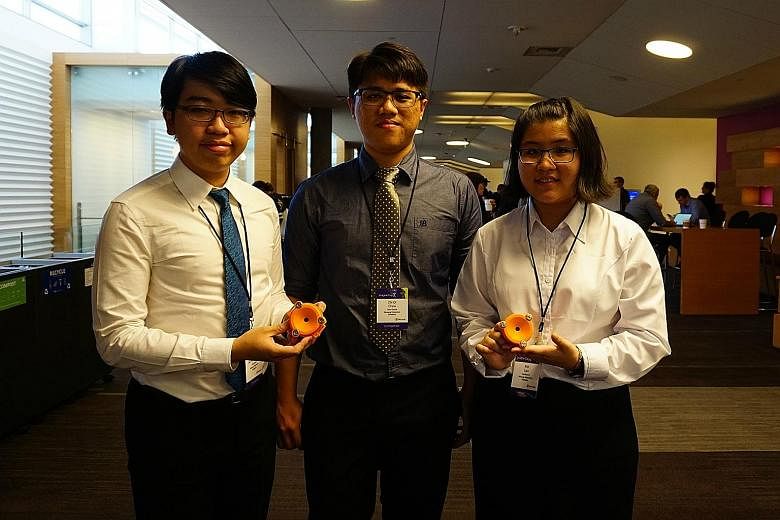 Nanyang Polytechnic students (from far left) Sean Wong, Chew Zhi Qi and Lian Min with their Smart StethoScope at the Microsoft Imagine Cup World Finals in Seattle last month. Home users can monitor their hearts for abnormal sounds just by wearing the