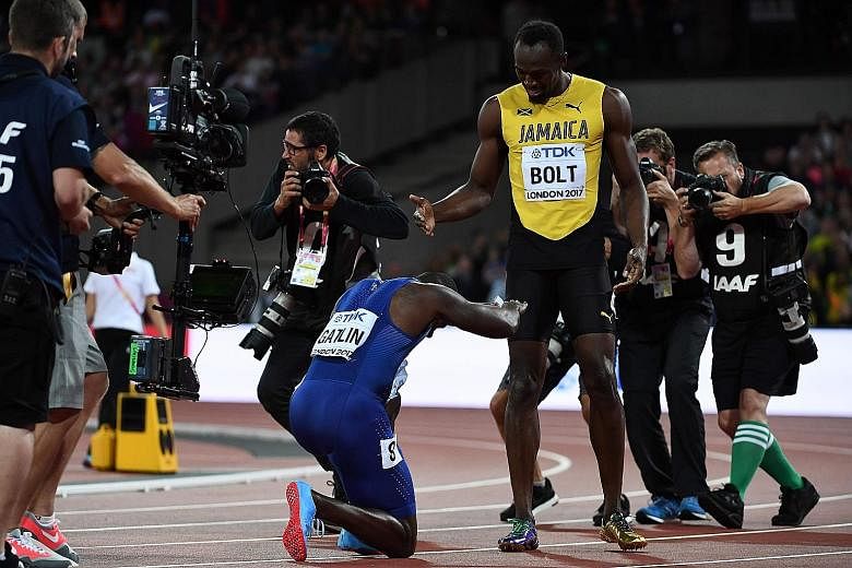 Justin Gatlin bowing down in respect to Usain Bolt, after his upset 100m win.