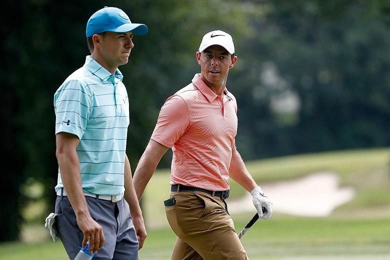 Jordan Spieth (left) and Rory McIlroy during the second round of the Bridgestone Invitational in Akron, Ohio, last Friday. If the American wins the next Major, the PGA Championship, this week, he will beat the Northern Irishman to a career Grand Slam