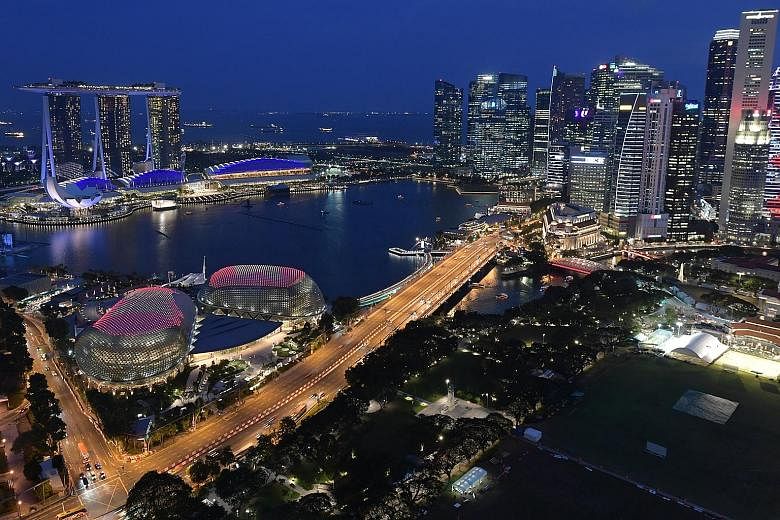 Singapore prepared to celebrate Asean's 50th year in style as it lit up the Esplanade last night with the grouping's emblem. The light-up, seen from Swissotel the Stamford, was a preview for the Philippines' Asean Landmark Lighting Initiative, which 