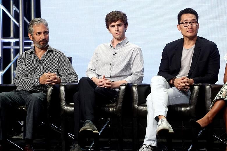The Good Doctor's (from far left) executive producer David Shore, actor Freddie Highmore and executive producer Daniel Dae Kim speak onstage at The Beverly Hilton Hotel in Beverly Hills, California.