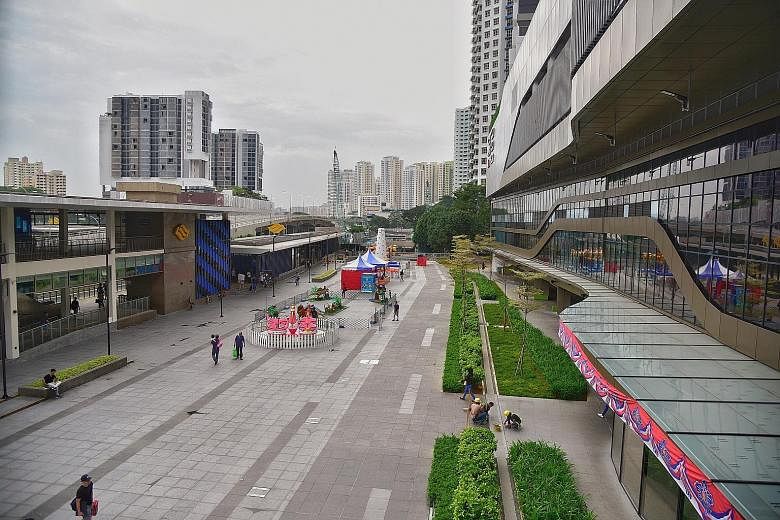 The Bukit Panjang Integrated Transport Hub, which is opening after a two-year delay, is also fully integrated with the six-month-old Hillion Mall (right). The hub has features to cater to wheelchair users, the elderly and those travelling with infant